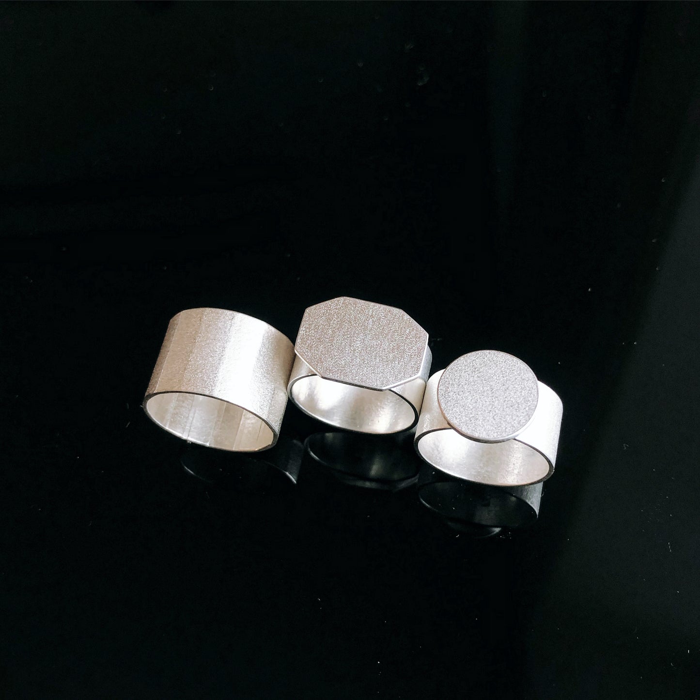 Silver textured ring (faceted band)