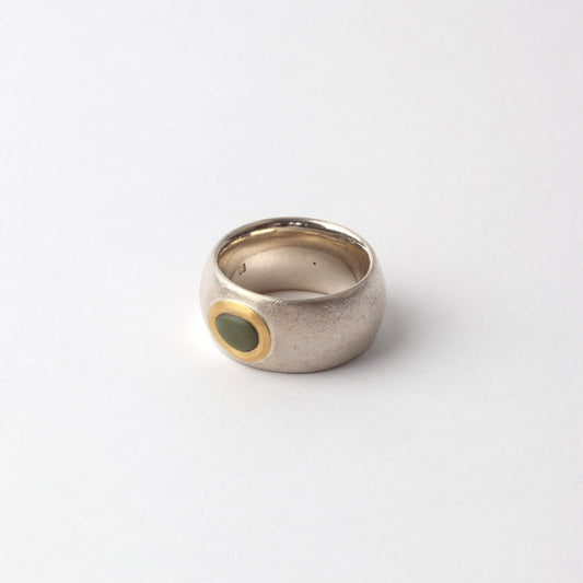 Silver ring with green pebble