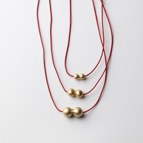 'Ball' pendants - gold