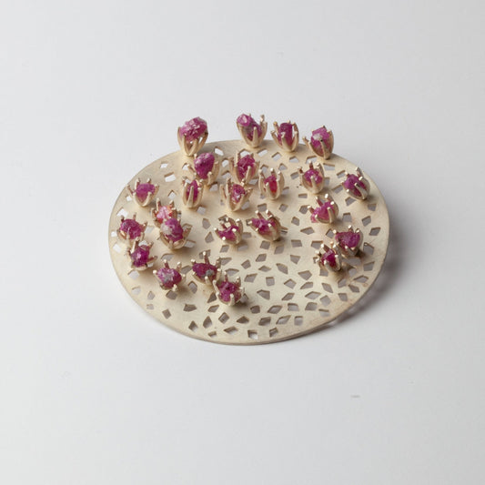 Kinetic brooch with rubies