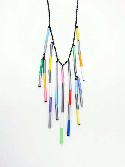 Necklace with colorful cylindrical beads on a white background