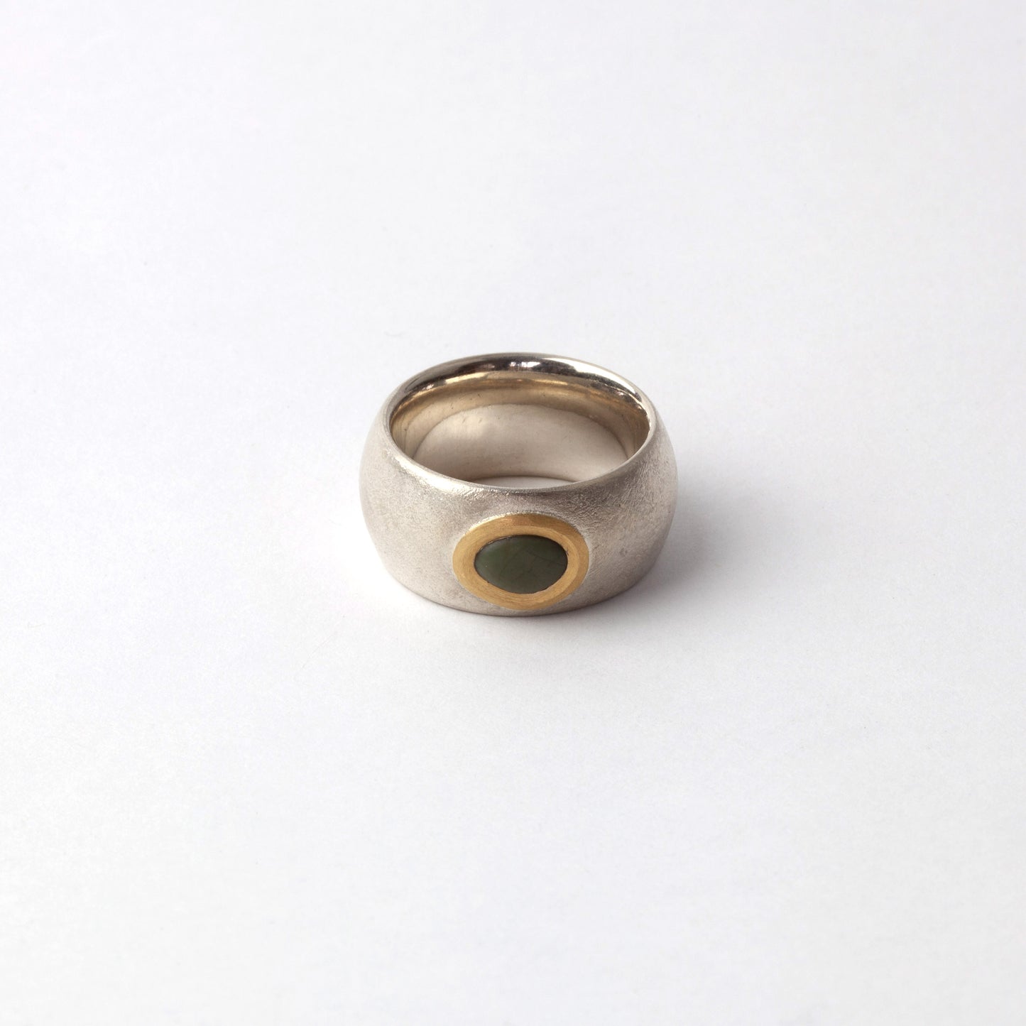Silver ring with green pebble