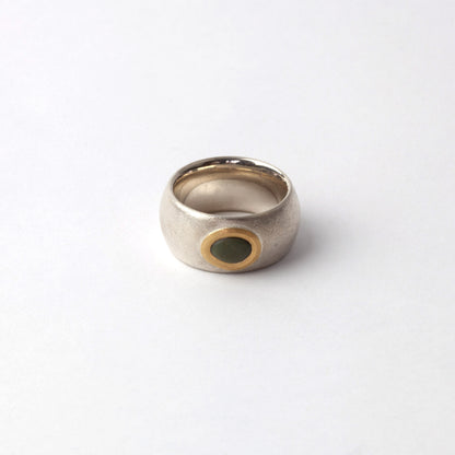 Silver ring with green pebble