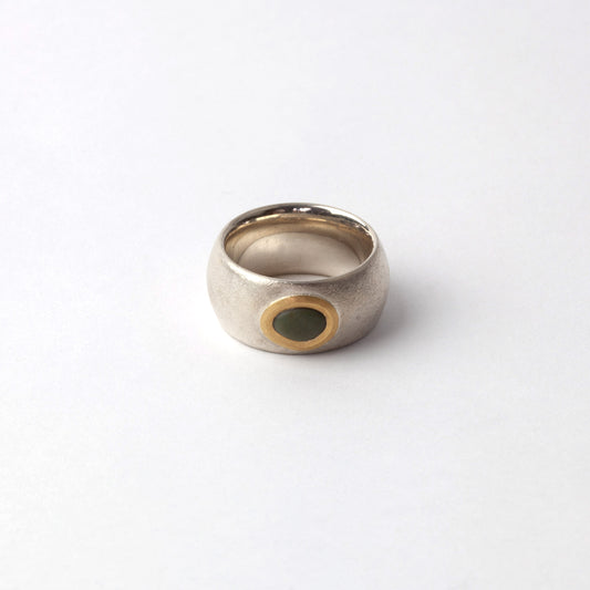Silver ring with green pebble