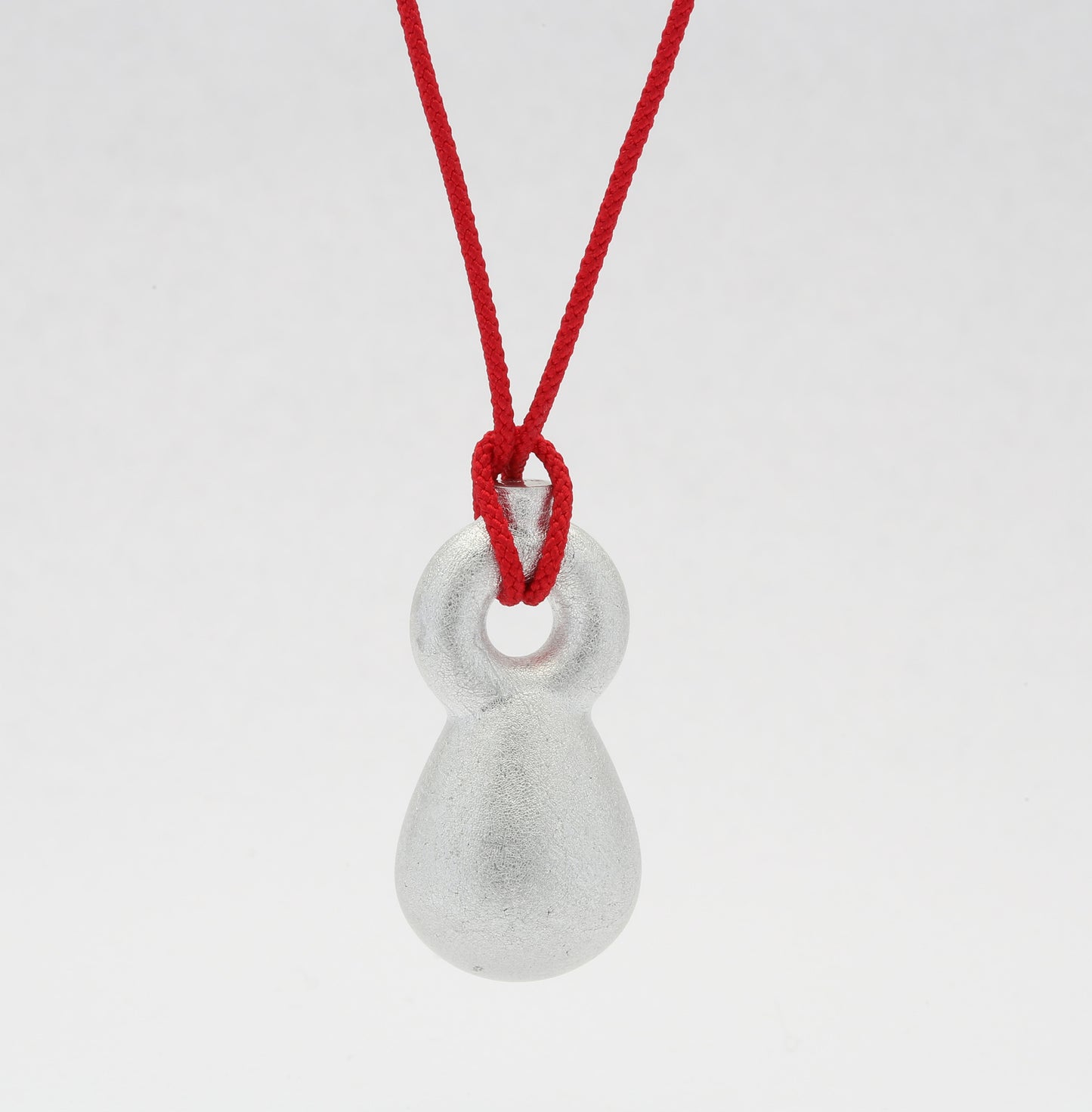 'Crossing Borders' pendants
