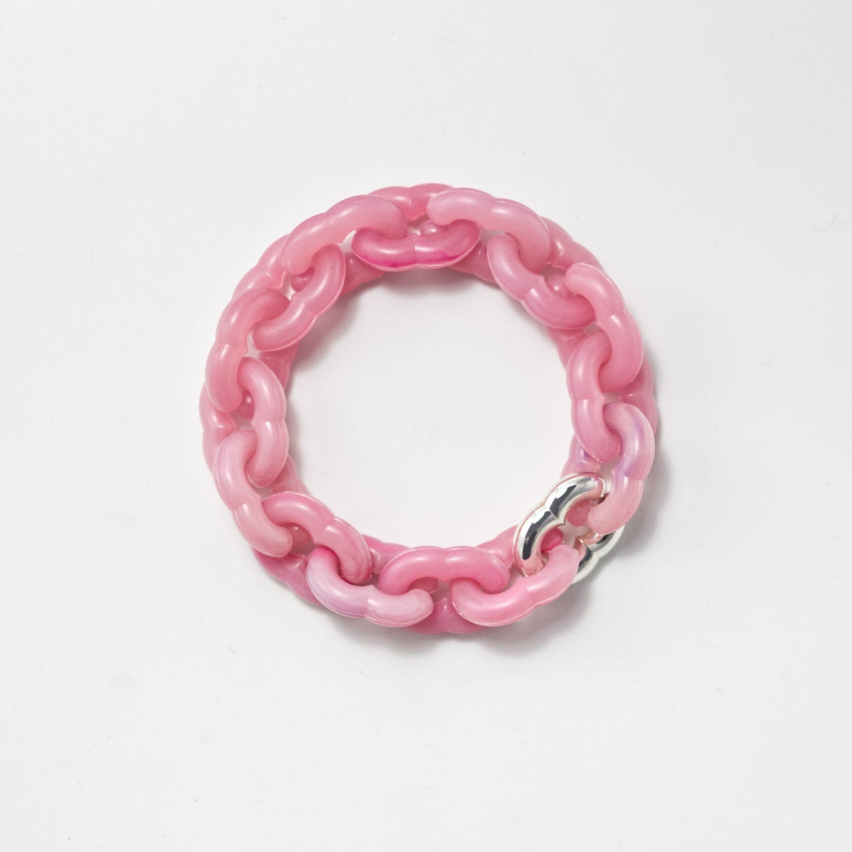 Pink chain bracelet on a white background