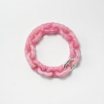 Pink chain bracelet on a white background