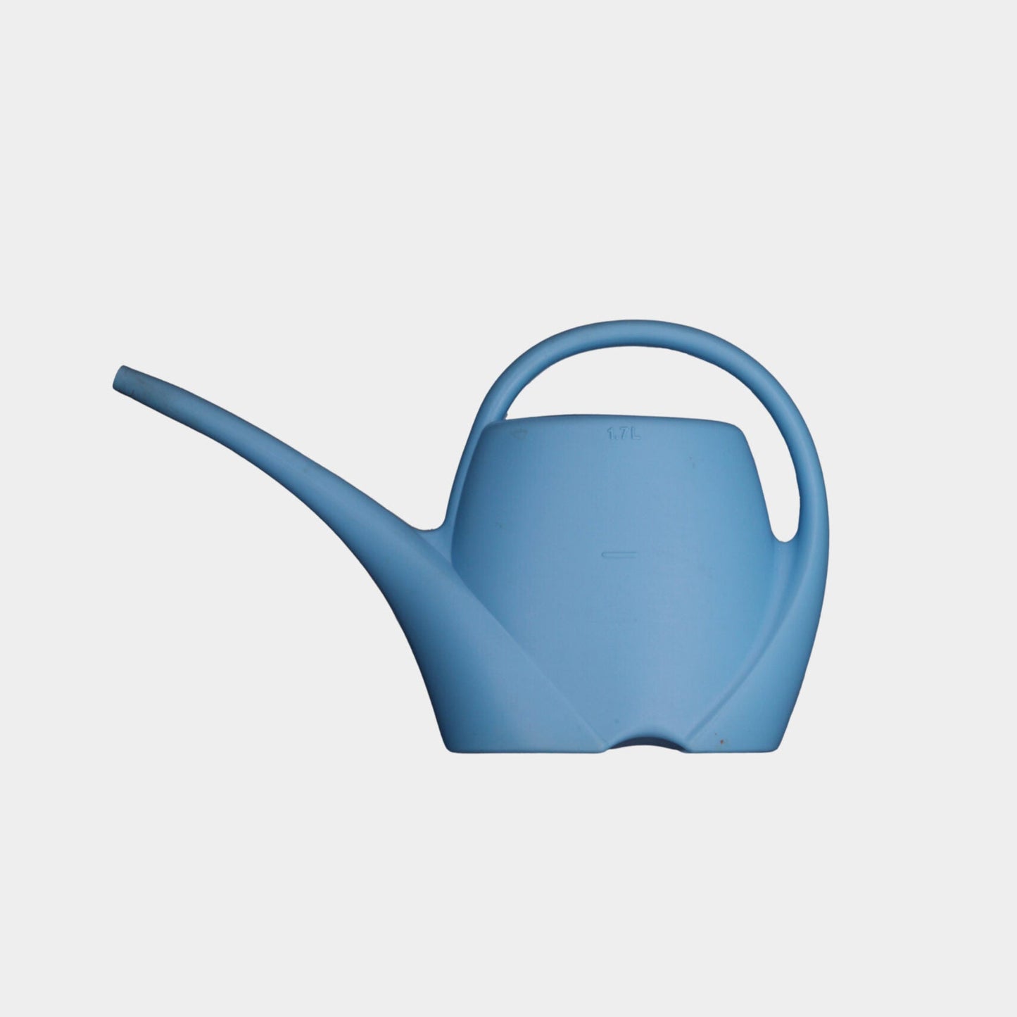 Blue watering can on a light gray background