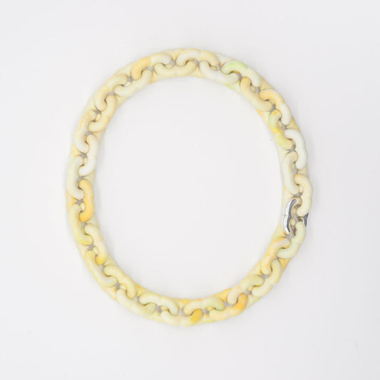 Yellow chain bracelet on a white background