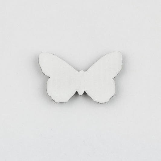 White butterfly-shaped object on a light gray background