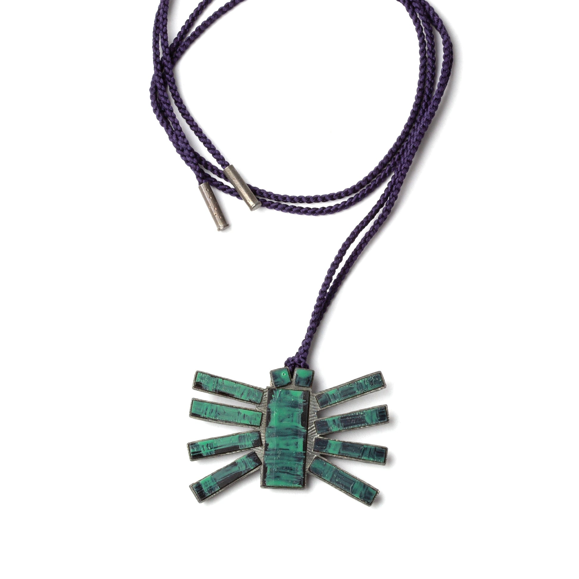 Necklace with a green stone pendant on a white background