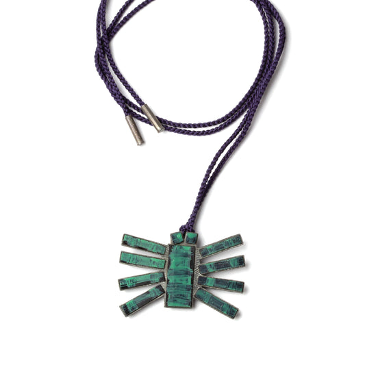 Necklace with a green stone pendant on a white background