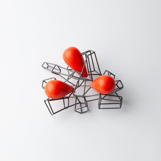 Brooch with red beads