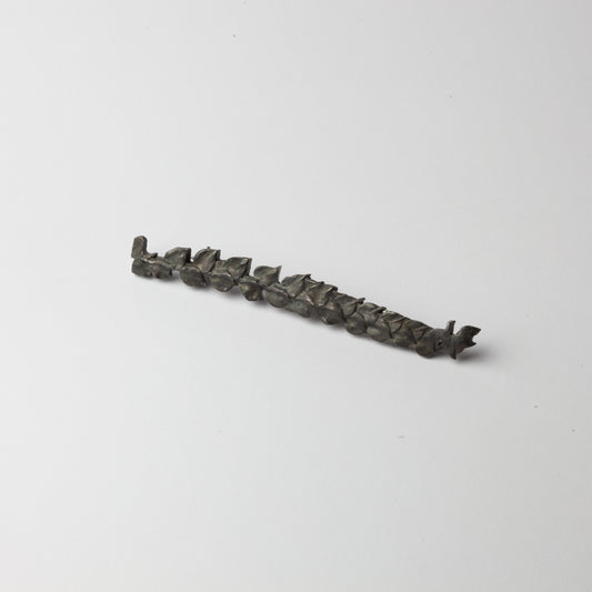 Long black leaf brooch