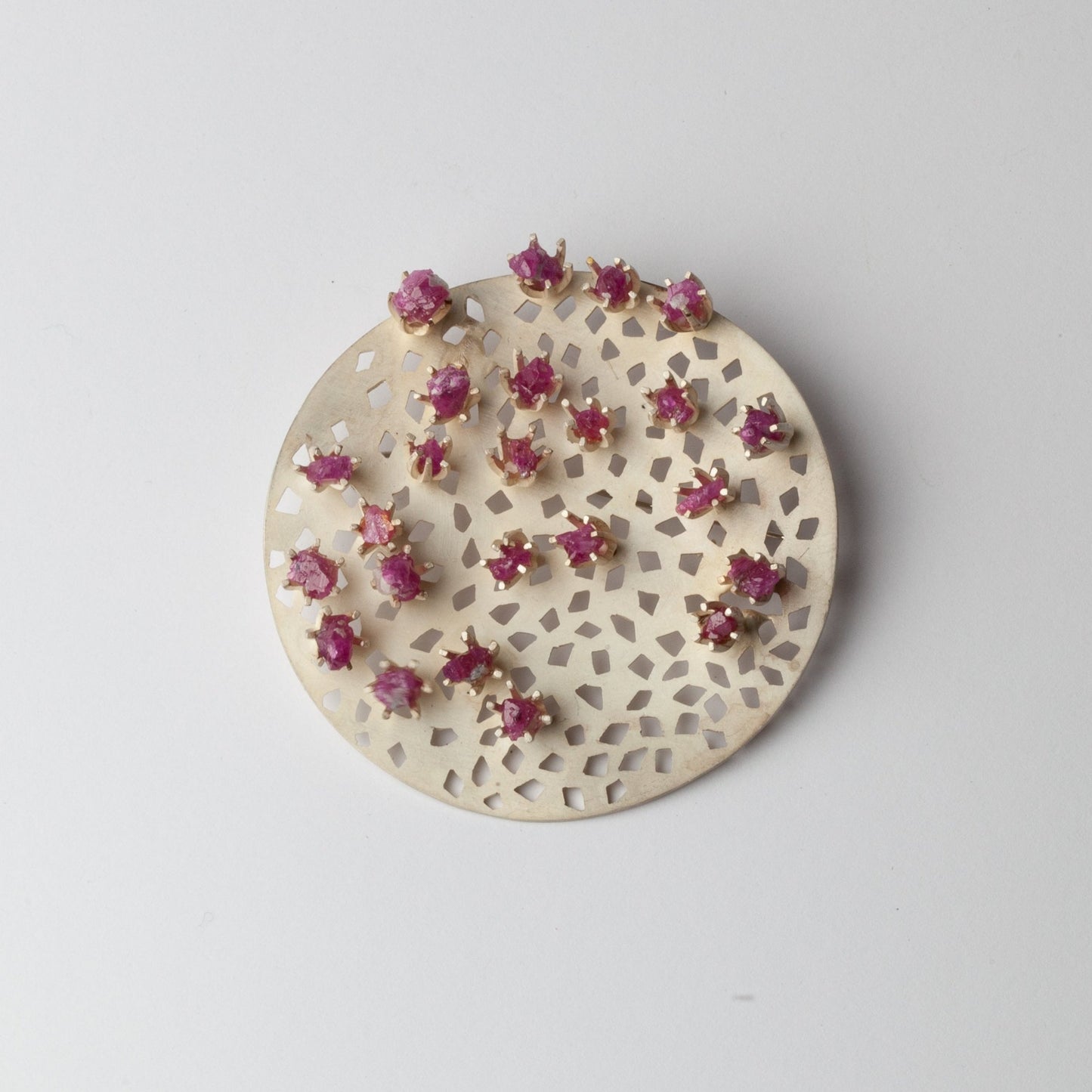 Kinetic brooch with rubies