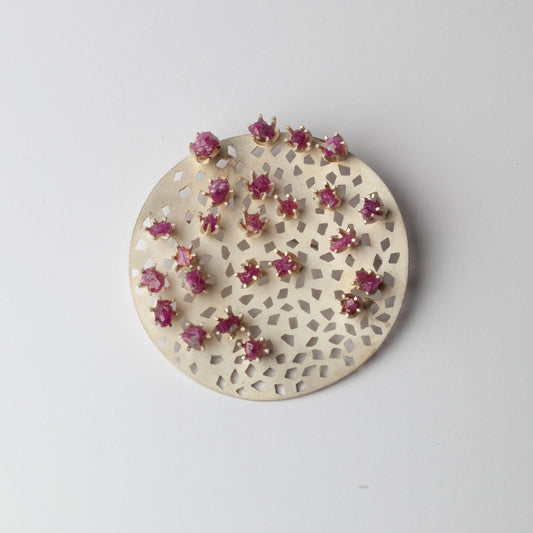Kinetic brooch with rubies