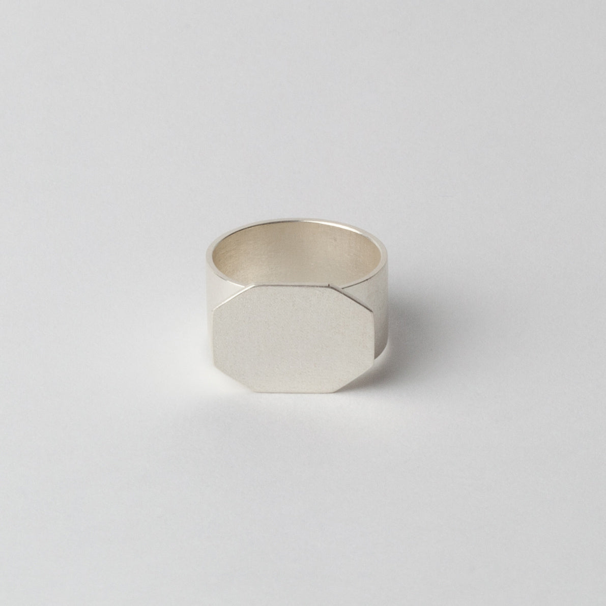 Silver textured ring (faceted front)