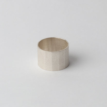 Silver textured ring (faceted band)