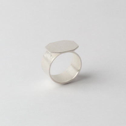 Silver textured ring (faceted front)