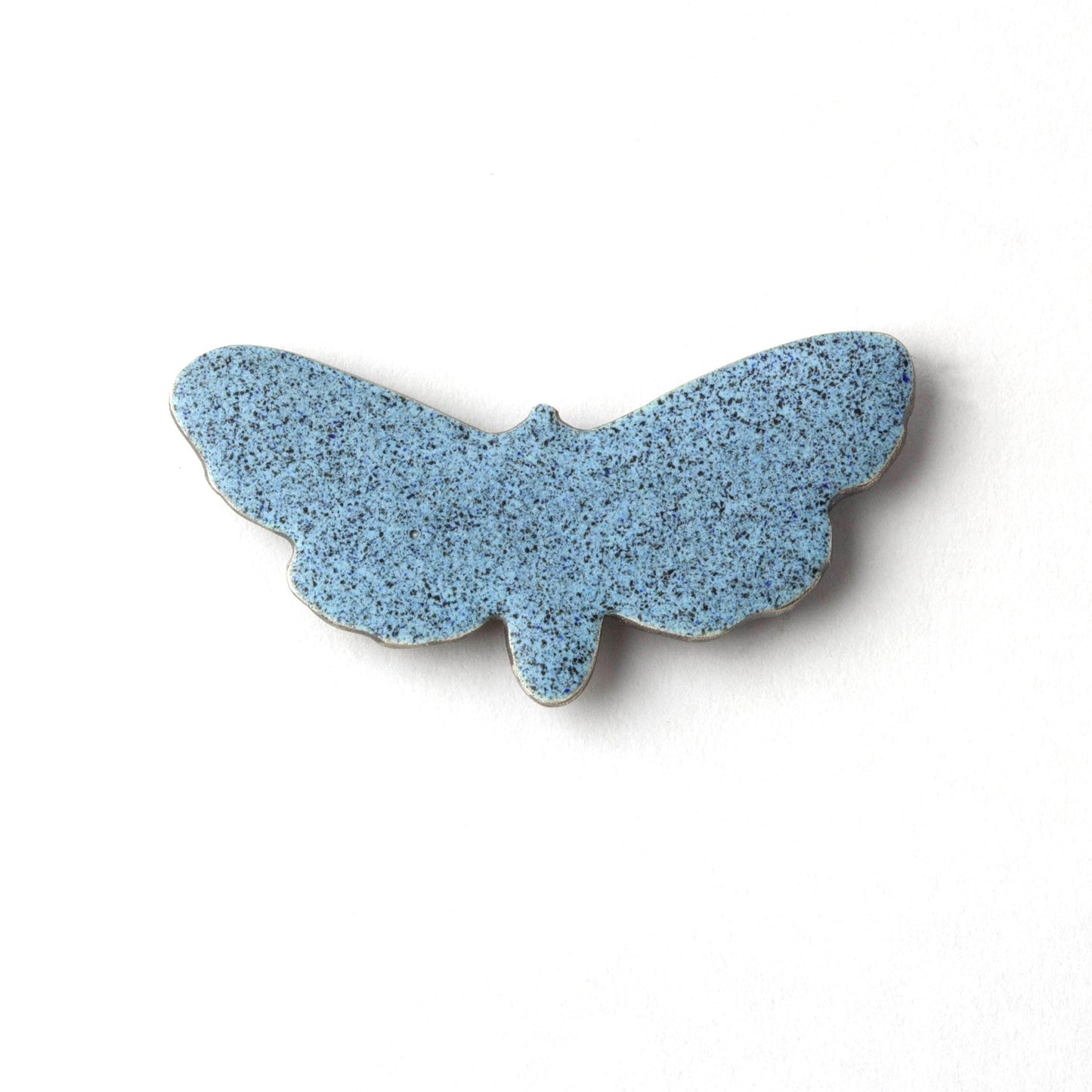 Blue butterfly-shaped object on a white background