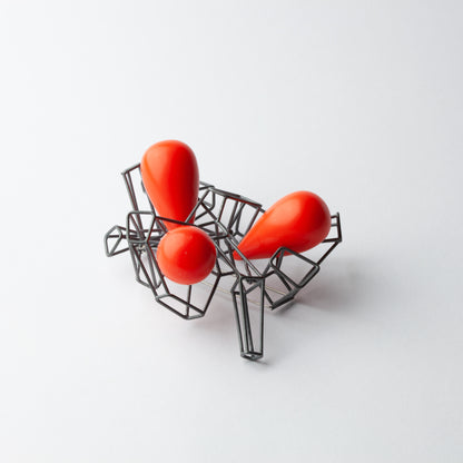 Brooch with red beads