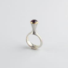 'Tower' ring with garnet