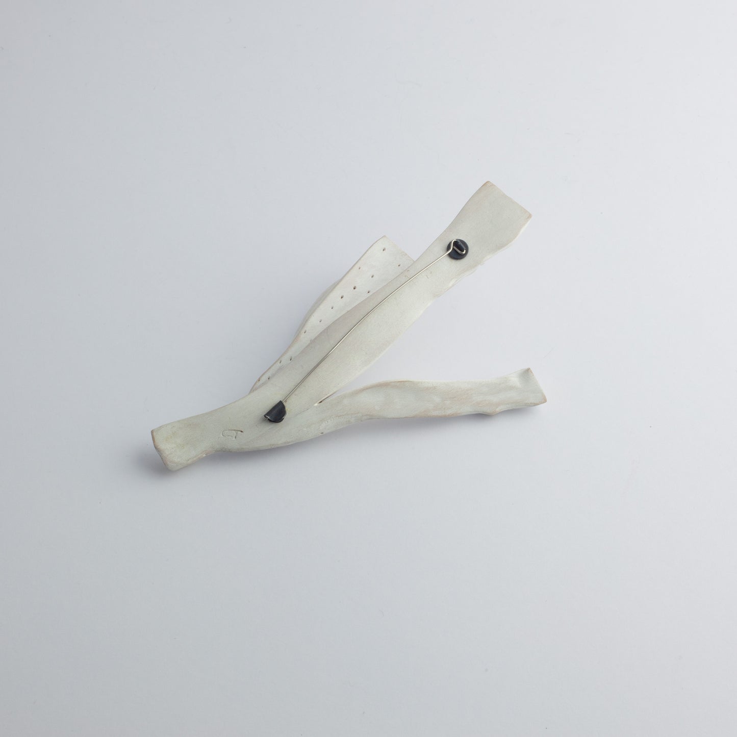 'Square cut sponge' carved brooch