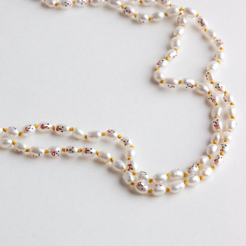 'Faces' necklace